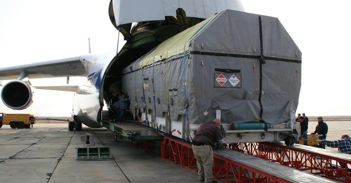 A massive cargo is loaded onto an Antonov aircraft at Baikonur, Kazakhstan.